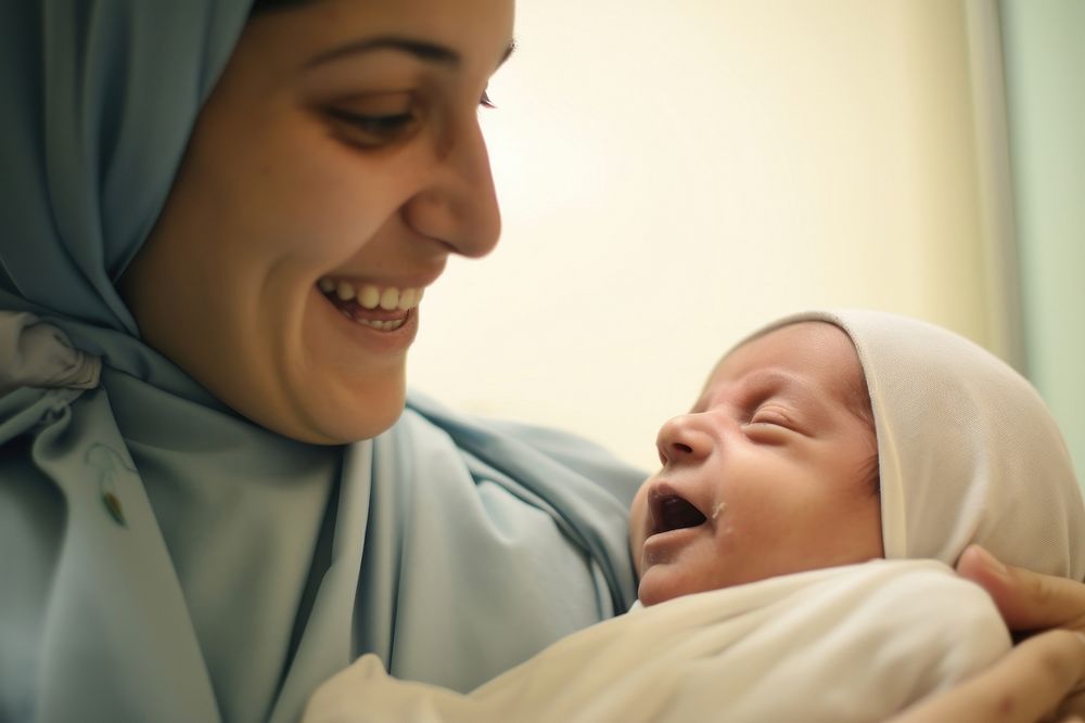 Middle east mother hold new baby born hospital skin togetherness. AI generated Image by rawpixel.