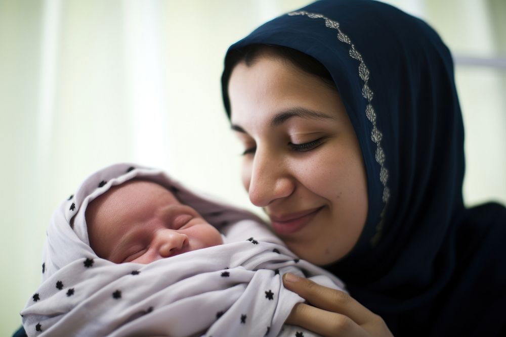 Middle east mother hold new baby born portrait newborn photo. AI generated Image by rawpixel.