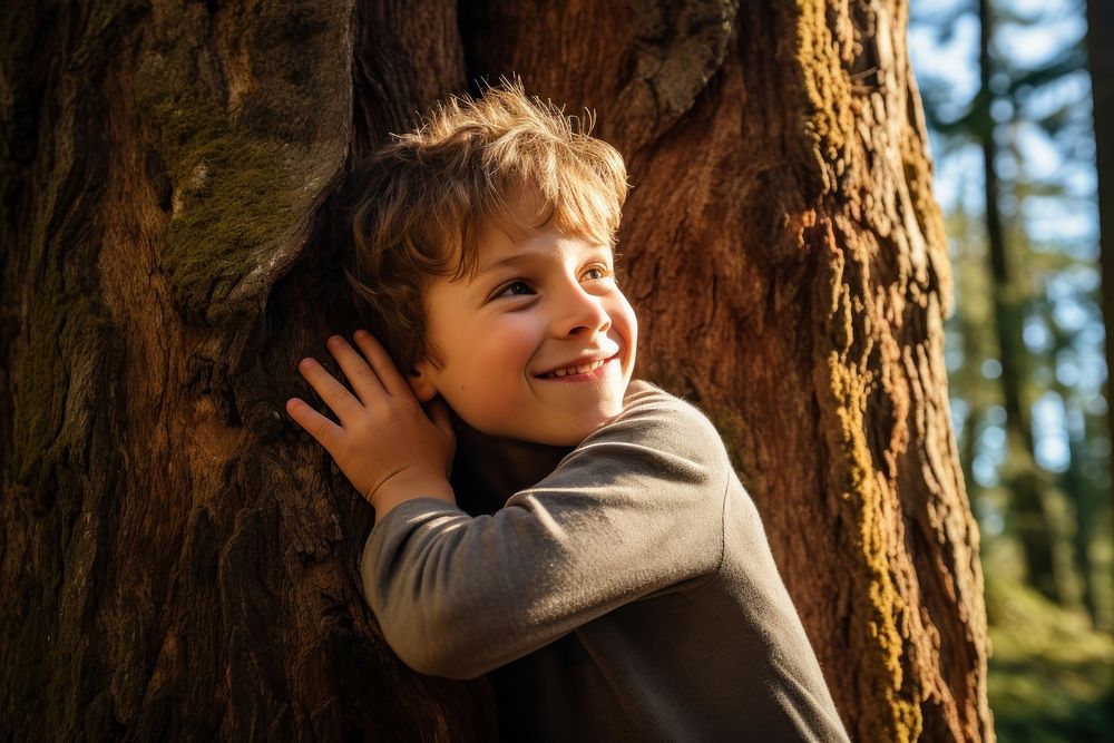 Kid hugging a big tree portrait forest child. AI generated Image by rawpixel.