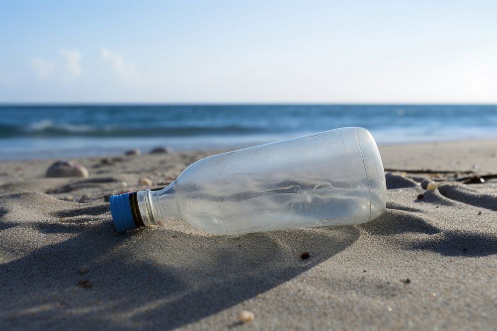 Plastic bottle on the beach outdoors nature sea. AI generated Image by rawpixel.