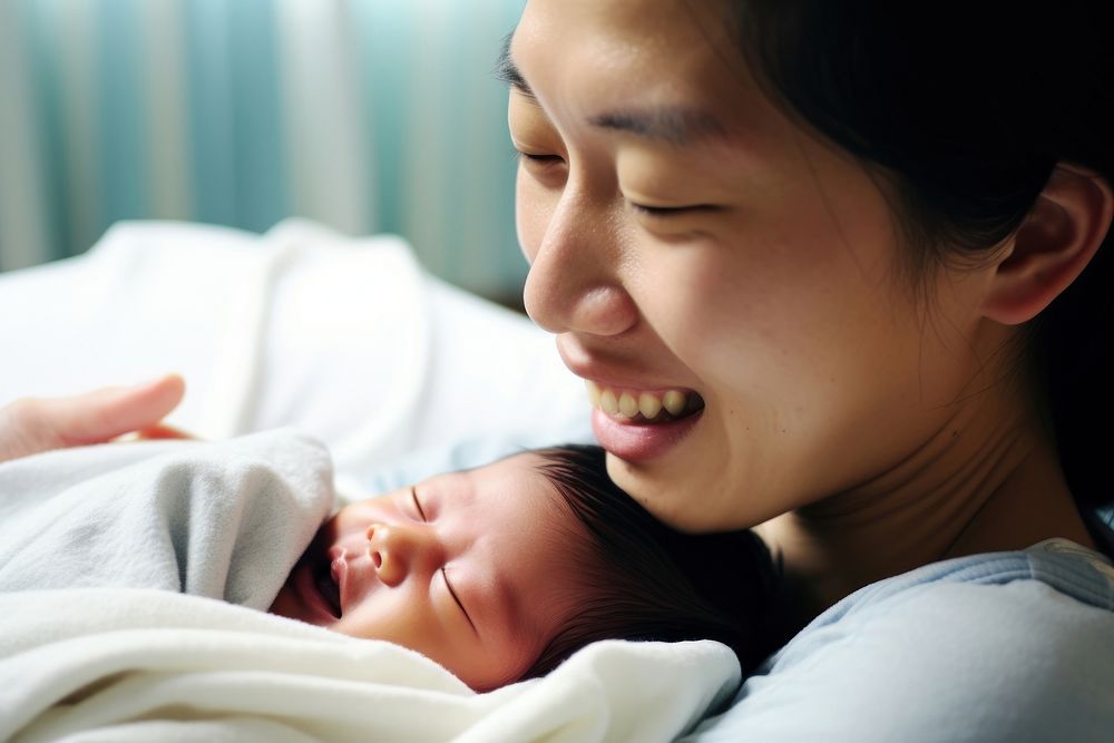 Asian mother hold new baby born portrait newborn adult. AI generated Image by rawpixel.