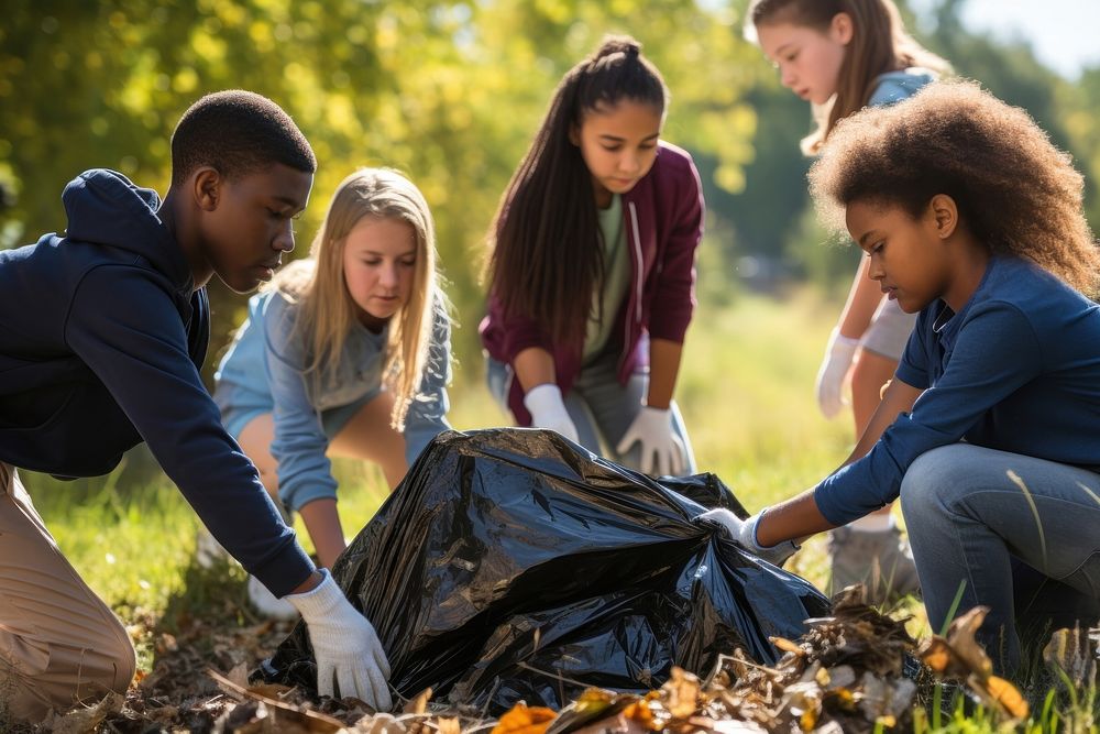 Kids putting garbage in the sack adult environmentalist togetherness. AI generated Image by rawpixel.