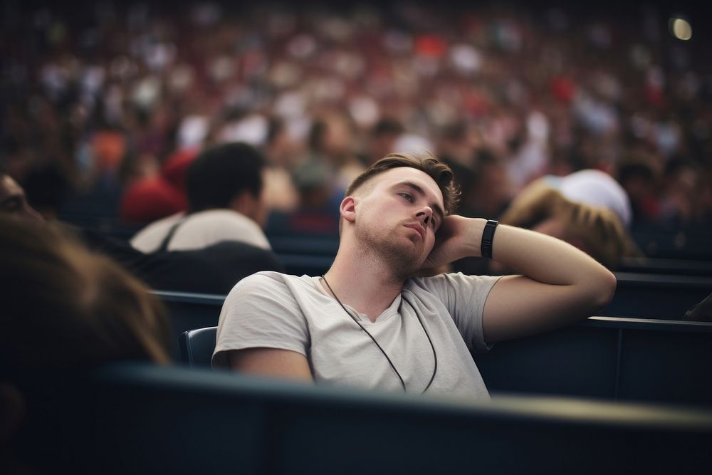 Male in crowd of fans feeling sleepy audience portrait adult. AI generated Image by rawpixel.
