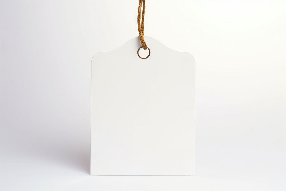 Price tag paper label bell shape white white background accessories. AI generated Image by rawpixel.
