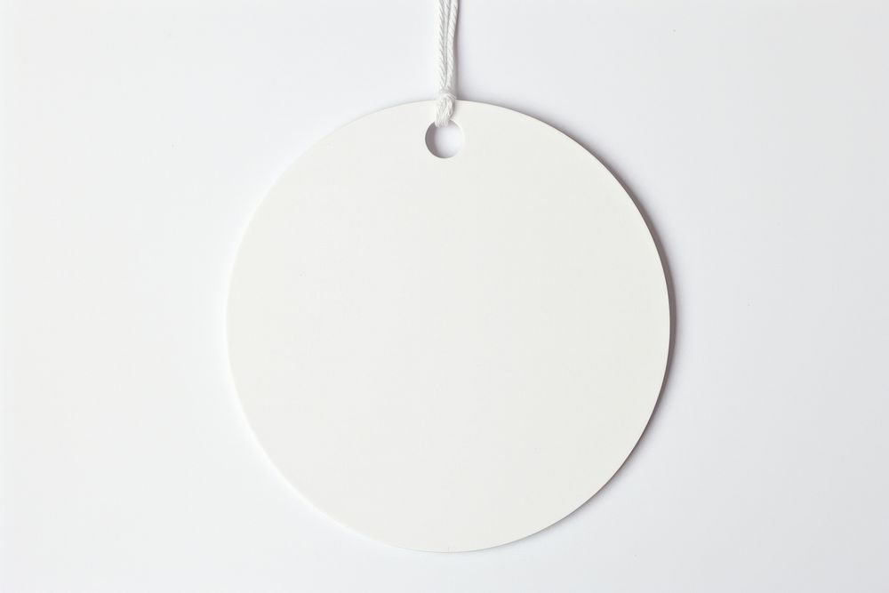 Price tag paper label circle shape white white background accessories. AI generated Image by rawpixel.