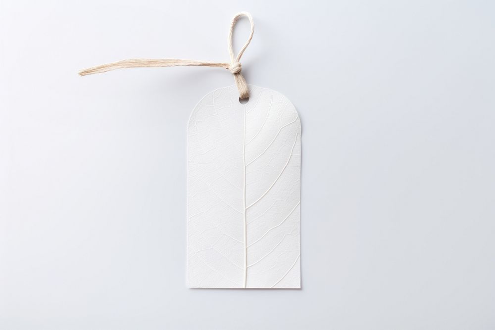 Price tag paper label leaf shape white art white background. AI generated Image by rawpixel.