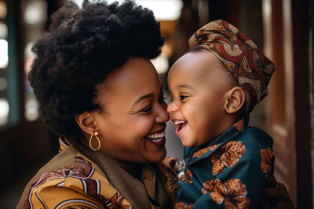 Black South African baby boy kissing his mother laughing portrait family. AI generated Image by rawpixel.