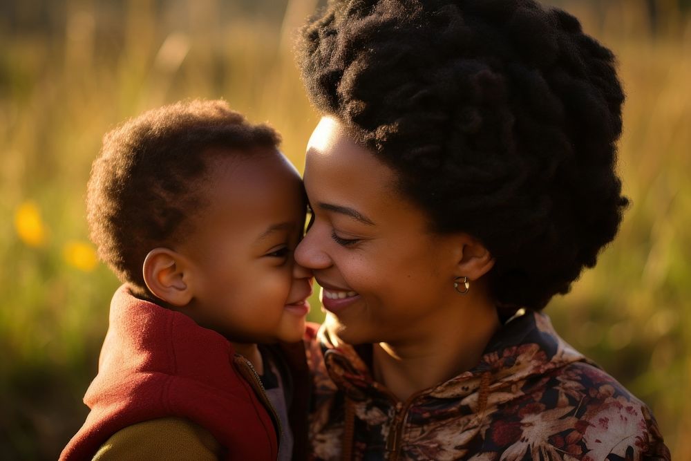 Black South African baby boy kissing his mother portrait family adult. AI generated Image by rawpixel.
