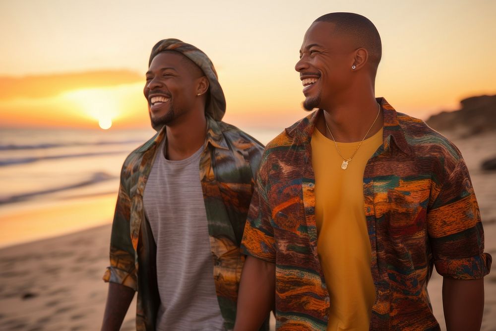 Black South African gay couple walking laughing sunset beach. AI generated Image by rawpixel.