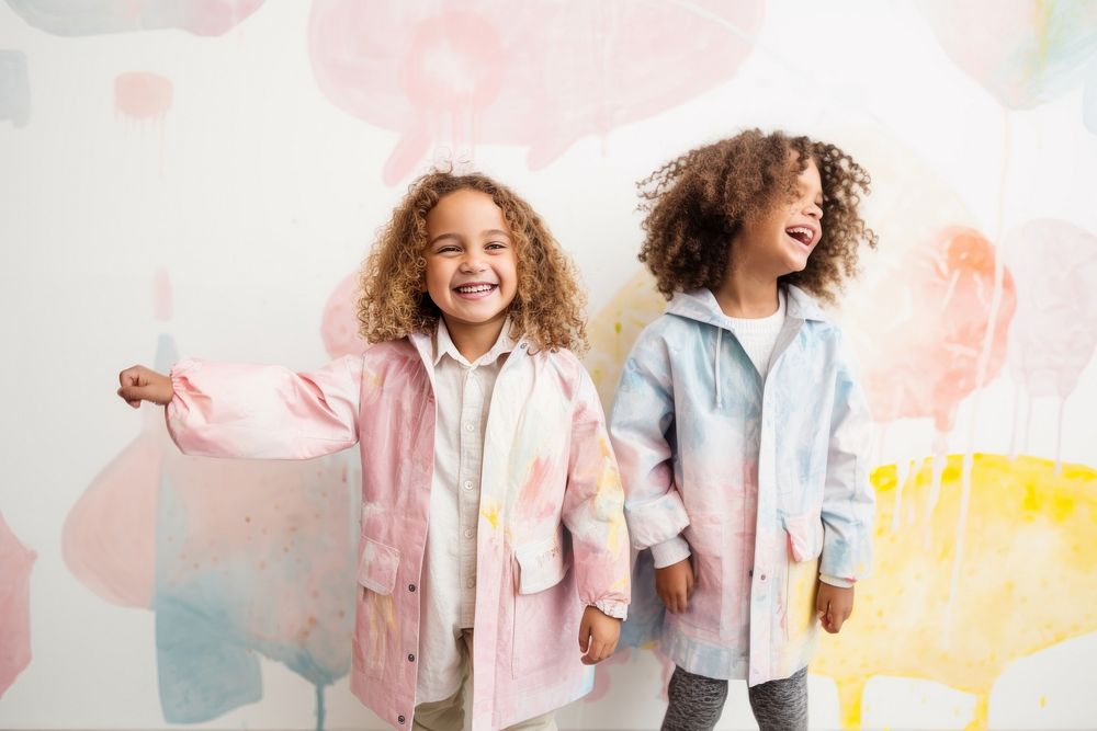 Girl and boy in pastel raincoat laughing child kid. AI generated Image by rawpixel.