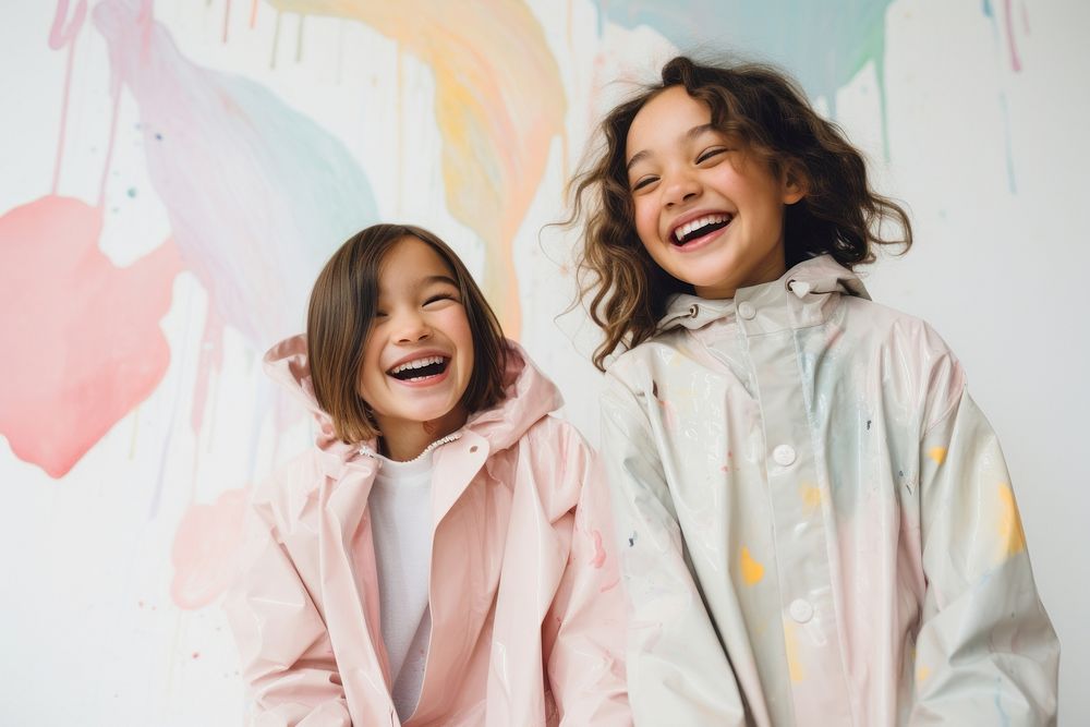 Girls in pastel raincoat laughing child smile. AI generated Image by rawpixel.