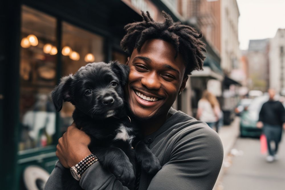 Happy black man hugging cute puppy pet portrait animal. AI generated Image by rawpixel.