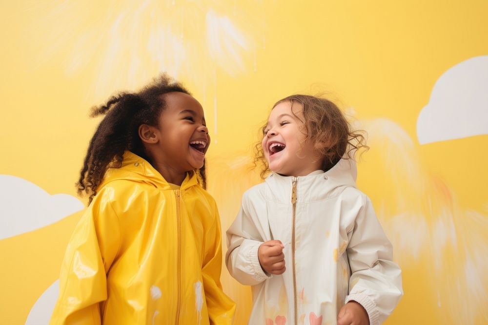 Girl in yellow raincoat laughing child baby. AI generated Image by rawpixel.