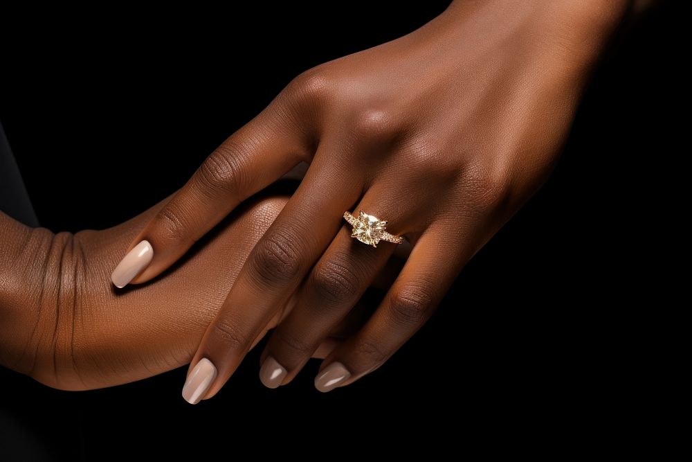 Hand wearing a ring gold with a diamond jewelry finger accessories. AI generated Image by rawpixel.
