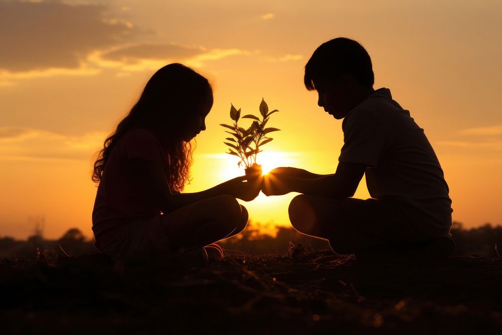 Boy and girl growing a plant sun silhouette outdoors. AI generated Image by rawpixel.