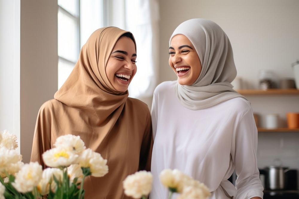 Women in hijab laughing at a kitchen smile togetherness friendship. AI generated Image by rawpixel.