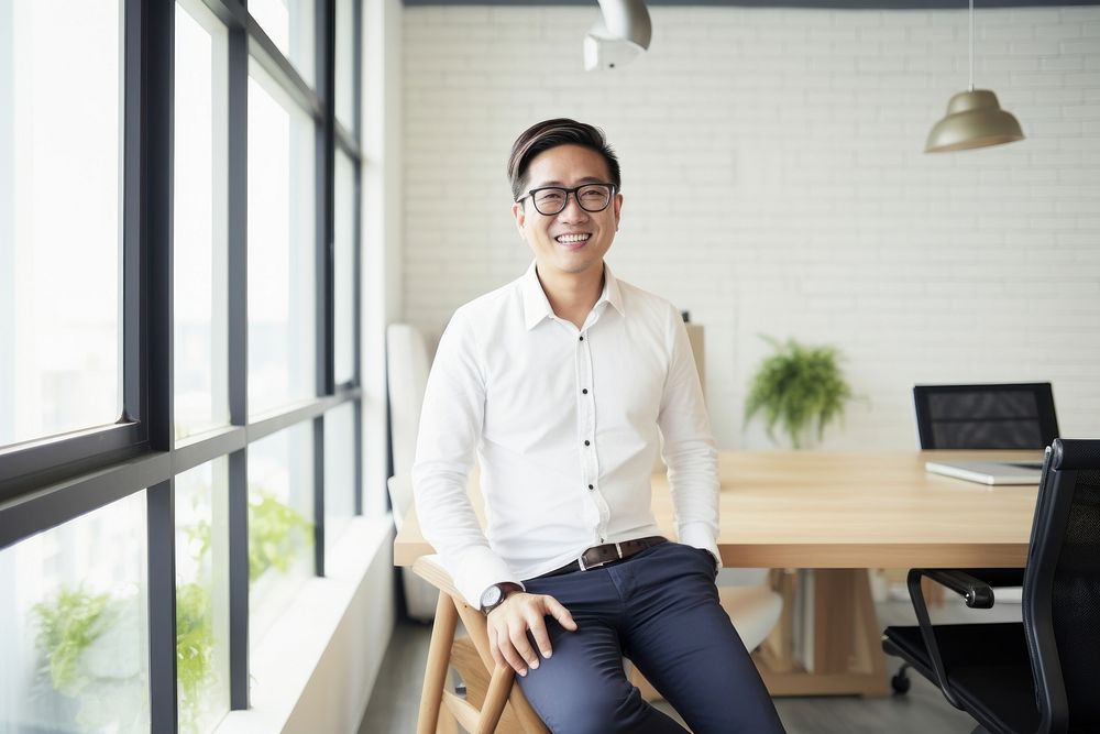 Taiwanese businessman computer sitting glasses. AI generated Image by rawpixel.