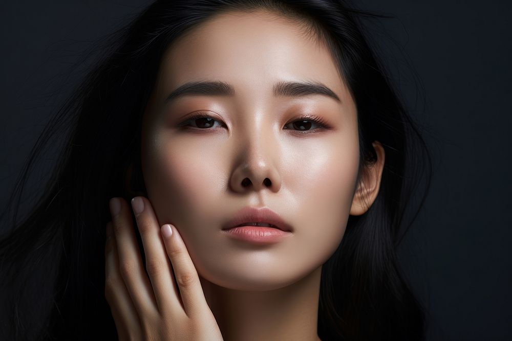 Korean woman touching her face portrait adult photo. AI generated Image by rawpixel.
