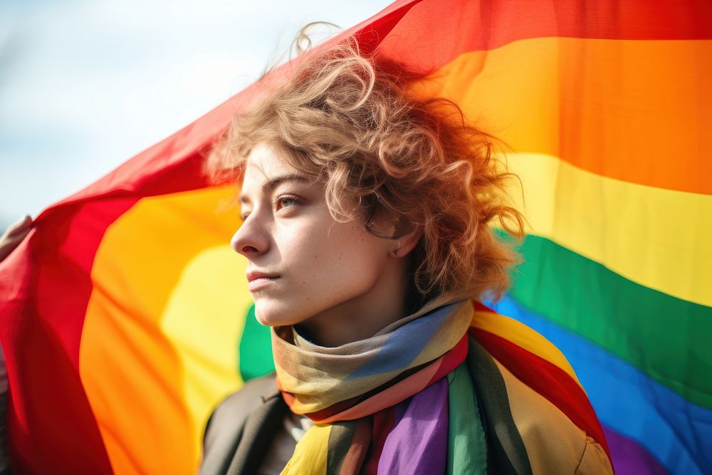 Lgbtq holding flag hairstyle portrait headshot. AI generated Image by rawpixel.