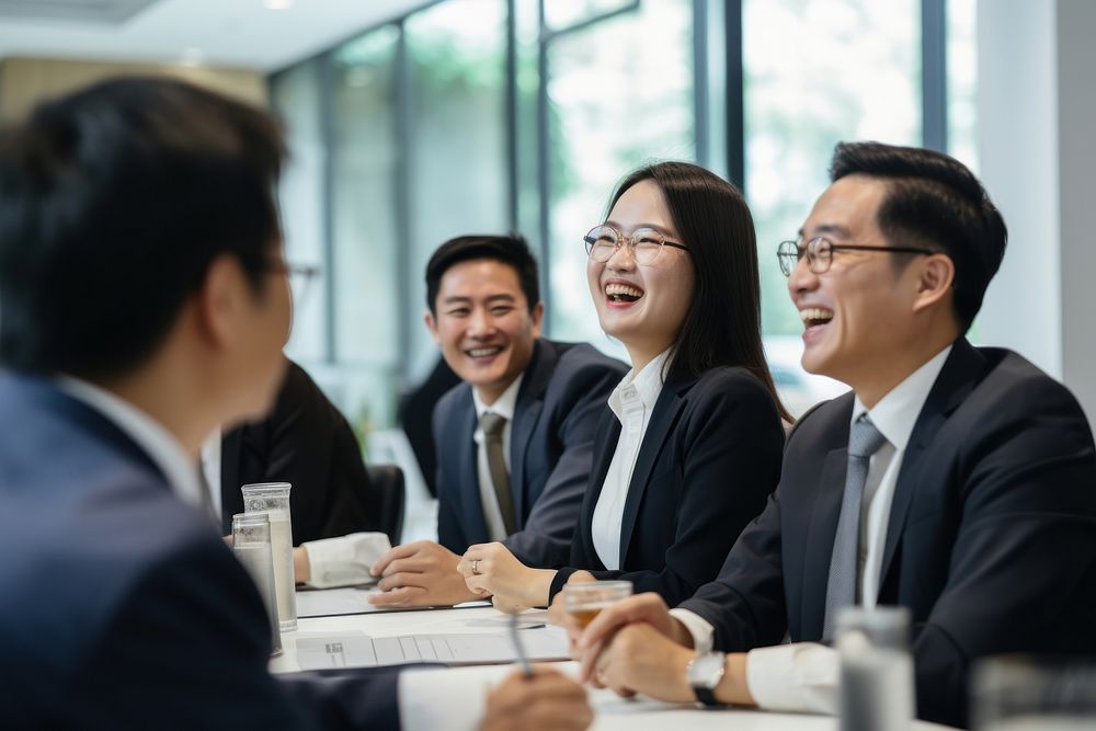 Professional Hong Kong businesspeople laughing meeting adult. AI generated Image by rawpixel.