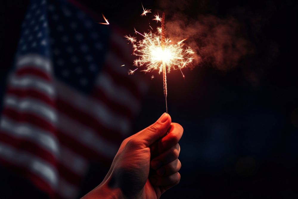 Hand hold sparkler and usa flag fireworks photo independence. AI generated Image by rawpixel.