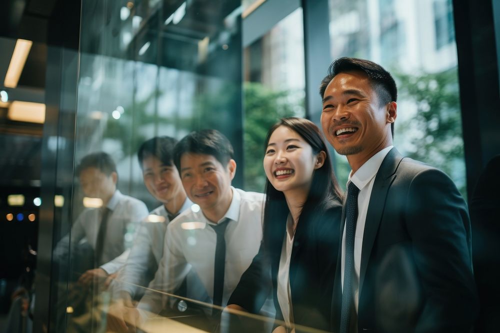 Japanese business people laughing smiling adult. AI generated Image by rawpixel.