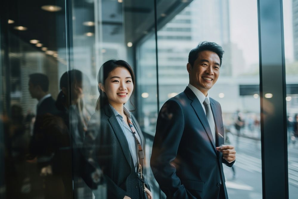 Japanese business people smiling adult glass. AI generated Image by rawpixel.