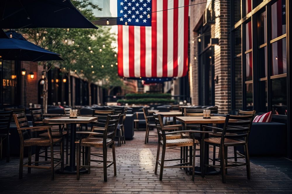 Outdoor seating at a restaurant with usa flag outdoors street chair. AI generated Image by rawpixel.