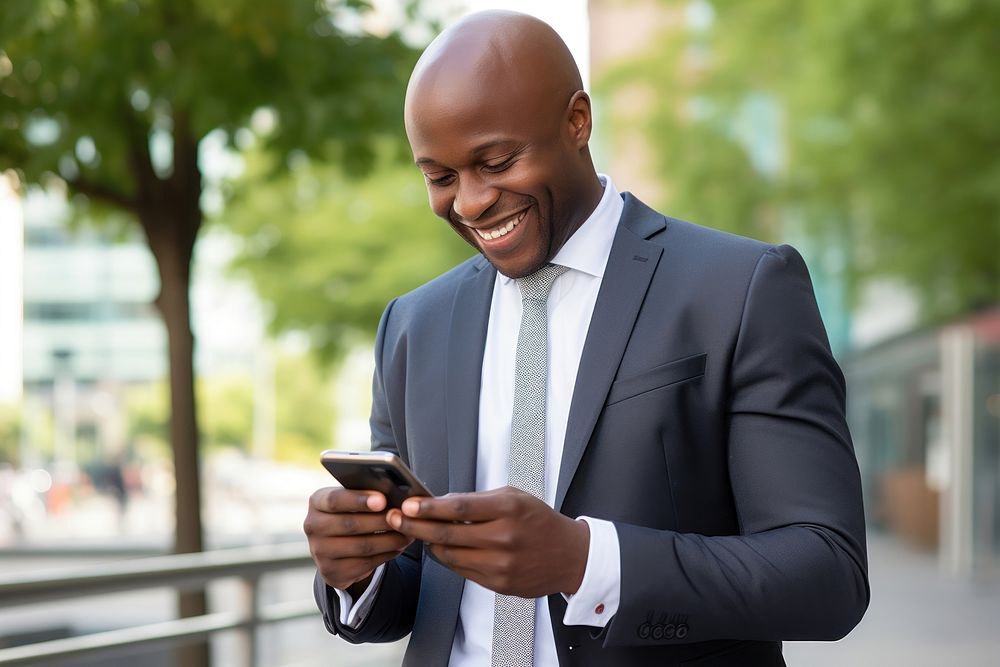 Black businessman adult smiling phone. AI generated Image by rawpixel.