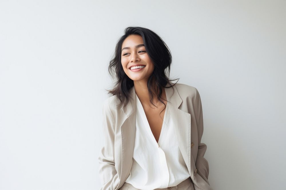 South east asian businesswoman laughing fashion smile. AI generated Image by rawpixel.