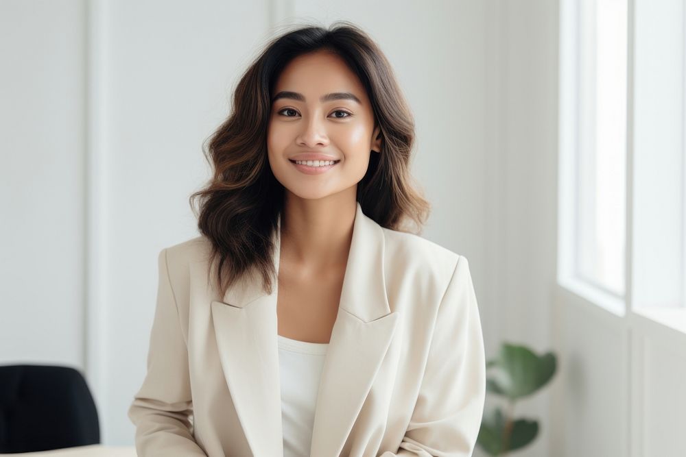 South east asian businesswoman smile happy contemplation. AI generated Image by rawpixel.