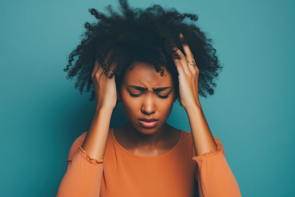 Black woman distressed hands on head stressed worried adult pain. AI generated Image by rawpixel.