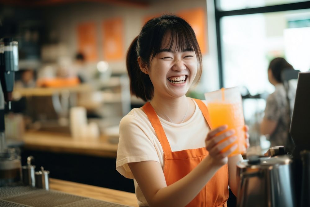 An asian multiracial woman bubble milk tea employee laughing holding adult. AI generated Image by rawpixel.