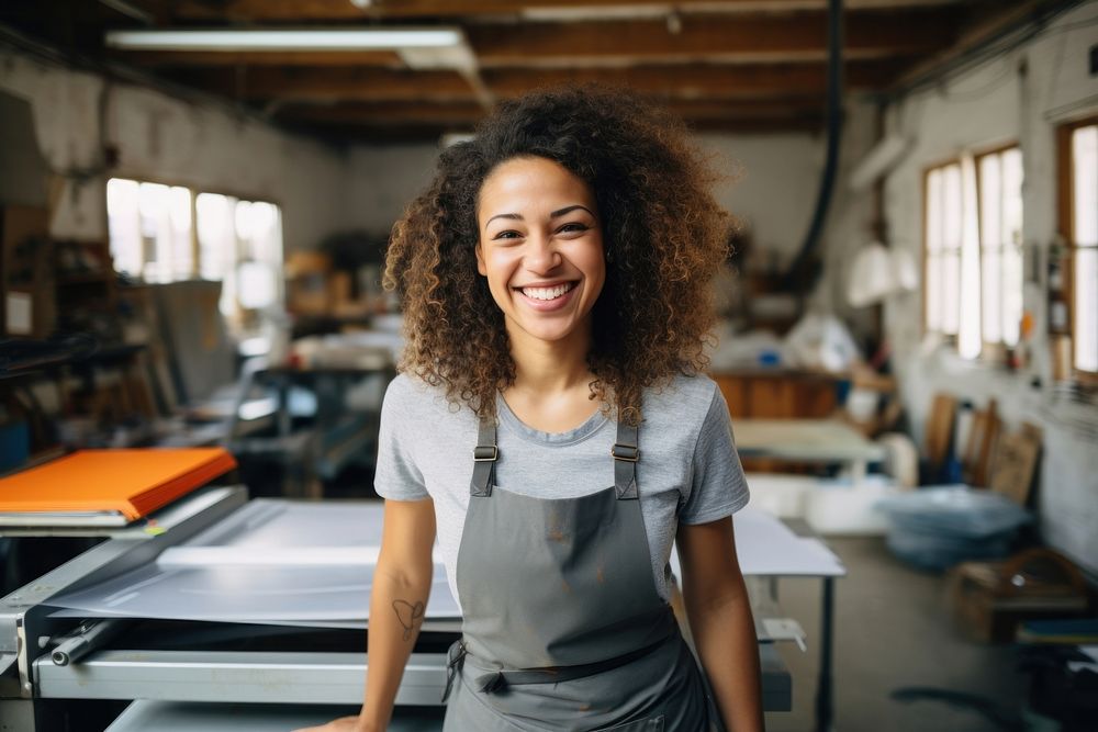 A multiracial woman of silk screen workers at their workshop smiling working adult. AI generated Image by rawpixel.