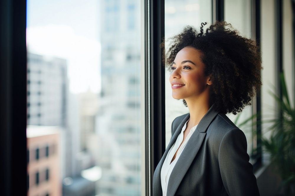 Affrican american businesswoman looking window office. AI generated Image by rawpixel.