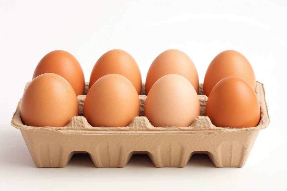 Fresh brown chicken eggs in an egg box carton food white background. AI generated Image by rawpixel.