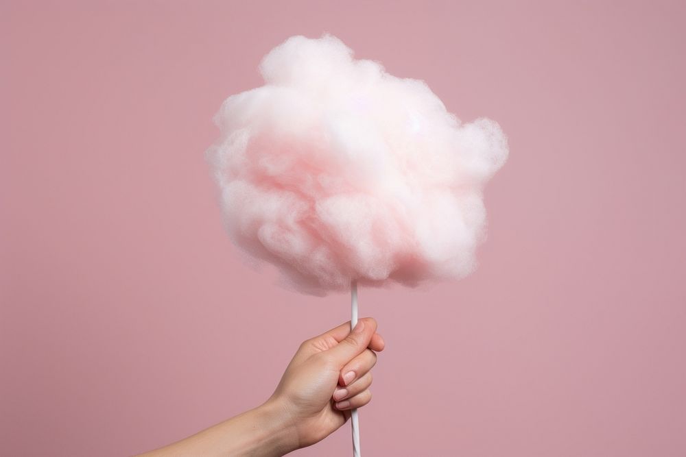 Hand holding cotton candy confectionery nature sweets. AI generated Image by rawpixel.
