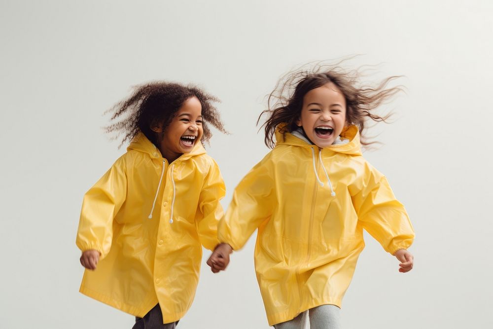 Girl in yellow raincoat child joy togetherness. AI generated Image by rawpixel.