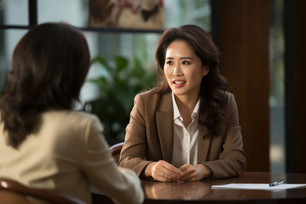 Vietnamese middleage businesswoman conversation interview adult. AI generated Image by rawpixel.
