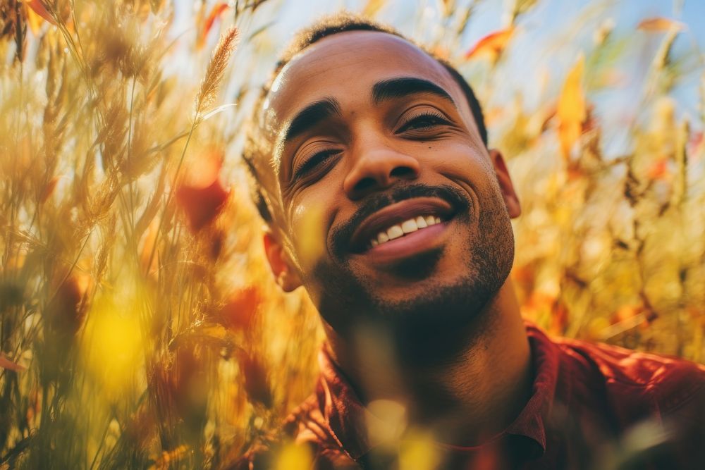 An close-up happy affrican man portrait photography landscape laughing. AI generated Image by rawpixel.