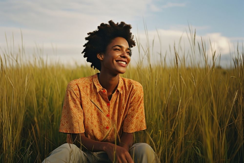 An happy affrican woman portrait landscape grass field. AI generated Image by rawpixel.
