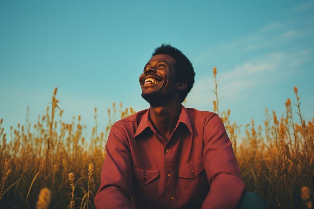 An happy affrican man portrait landscape smile grass. AI generated Image by rawpixel.
