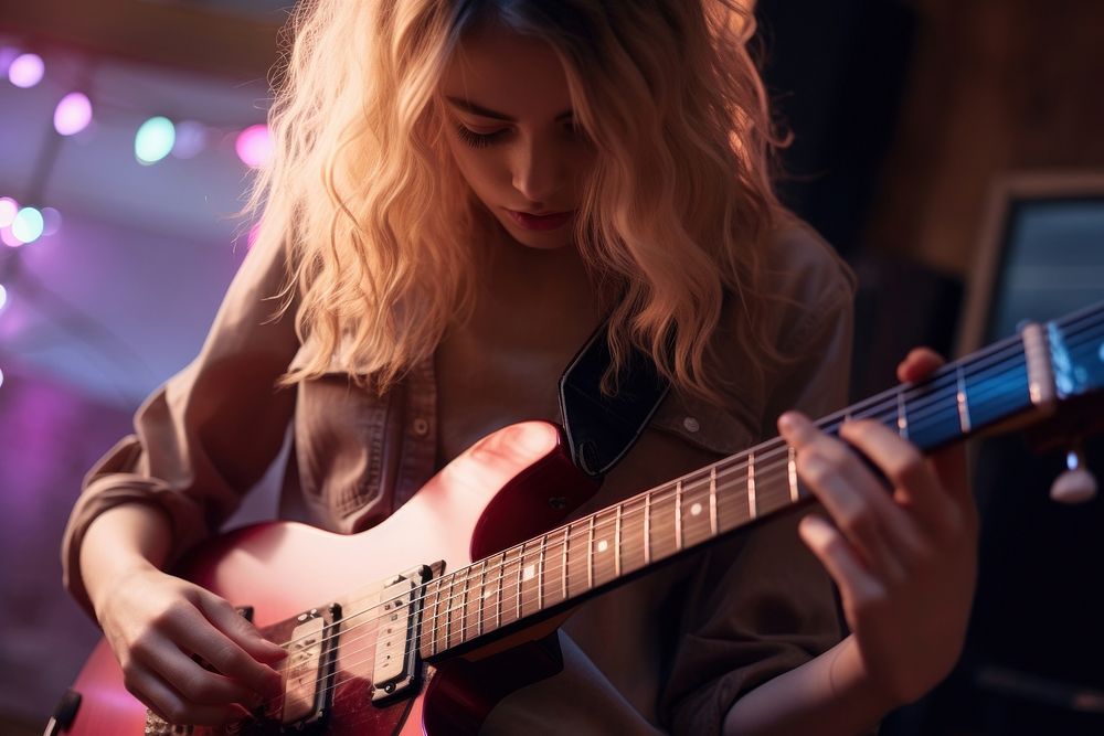 Young girl playing electreic guitar musician adult entertainment. AI generated Image by rawpixel.