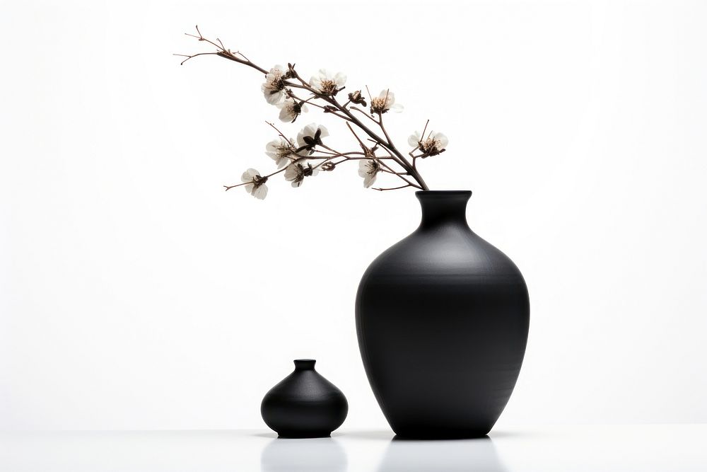 Black flower vase decoration pottery plant. AI generated Image by rawpixel.