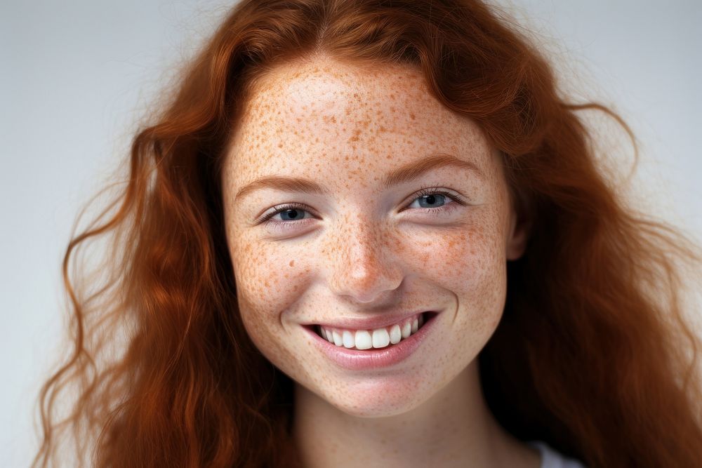 A happy woman with freckles on her face portrait adult photo. AI generated Image by rawpixel.