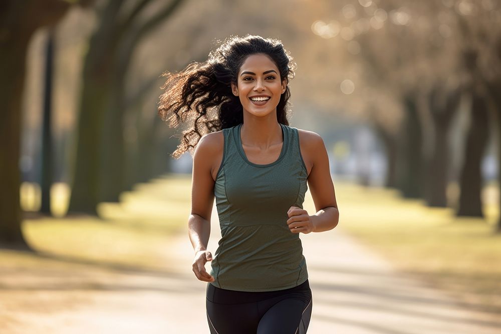 Indian woman running jogging smiling. AI generated Image by rawpixel.