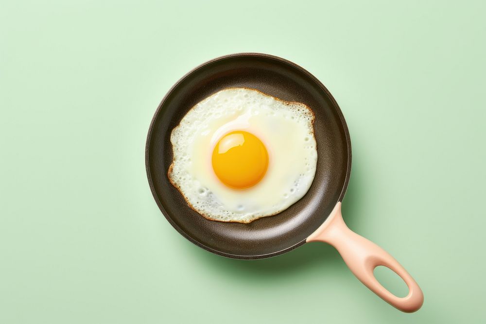 Fried egg on pan food breakfast freshness. AI generated Image by rawpixel.