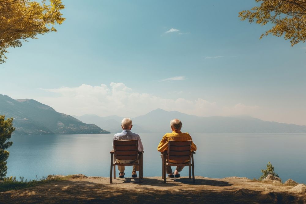 Two old man looking at the lake with the water out back landscape outdoors vacation. 