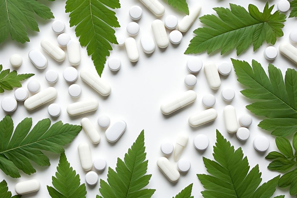 White pills on leaf backgrounds plant herbs. AI generated Image by rawpixel.