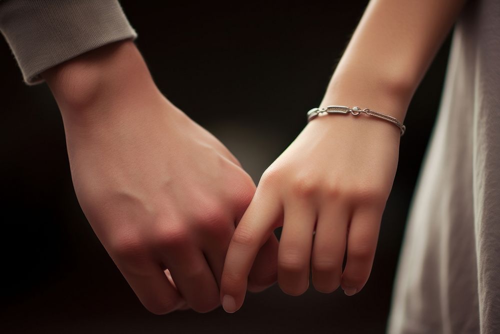 Holding hands finger bracelet jewelry. AI generated Image by rawpixel.
